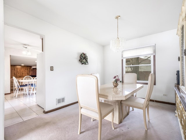 1602 S Surrey Ln, Arlington Heights, IL 60005 - dining room with light colored carpet, baseboards, visible vents, and ceiling fan with notable chandelier