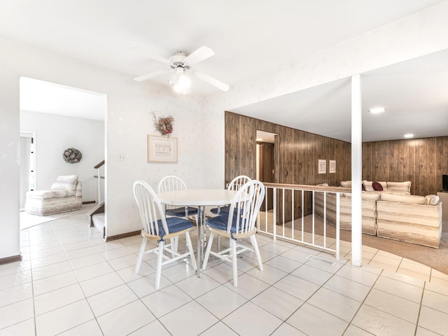 1602 S Surrey Ln, Arlington Heights, IL 60005 - dining room with ceiling fan, wooden walls, light tile patterned floors, baseboards, and stairway