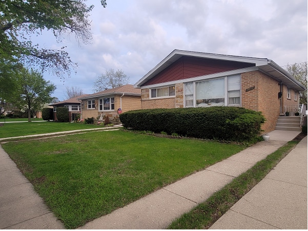 3843 Dempster St, Skokie, IL 60076 - view of front facade with brick siding and a front lawn