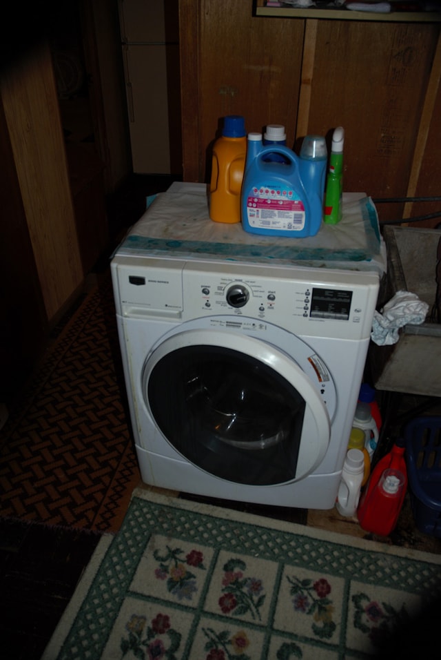 3843 Dempster St, Skokie, IL 60076 - laundry room featuring wood walls and washer / dryer