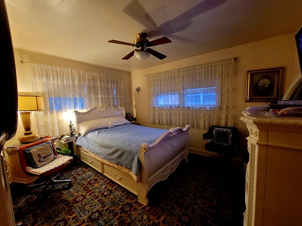 3843 Dempster St, Skokie, IL 60076 - carpeted bedroom featuring ceiling fan