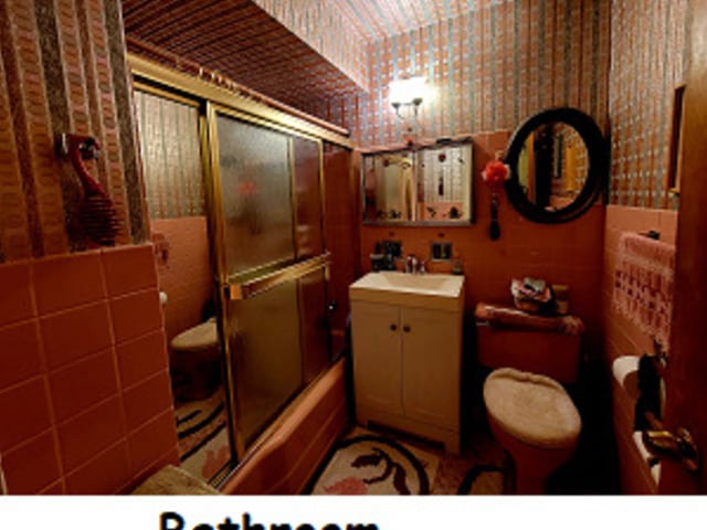 3843 Dempster St, Skokie, IL 60076 - full bathroom featuring vanity, enclosed tub / shower combo, and toilet