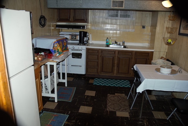 3843 Dempster St, Skokie, IL 60076 - kitchen featuring a sink, ventilation hood, white appliances, tile counters, and visible vents