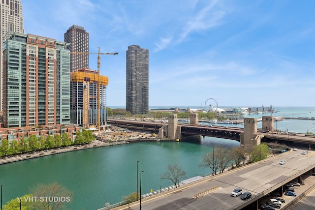 dock area with a water view and a city view