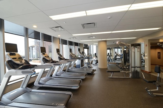 exercise room with a drop ceiling