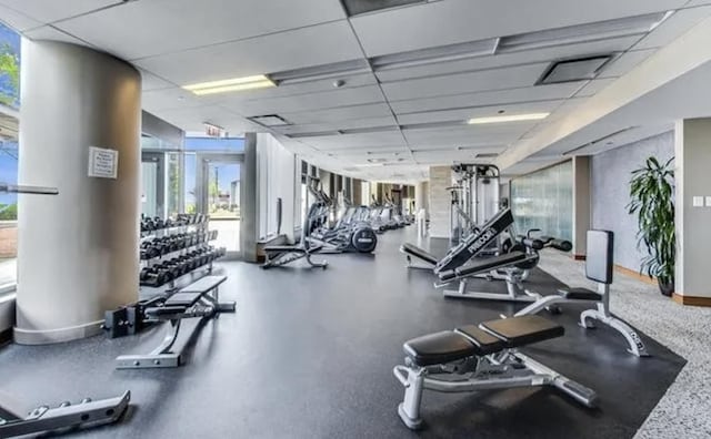 exercise room featuring a drop ceiling