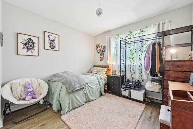 bedroom with wood finished floors