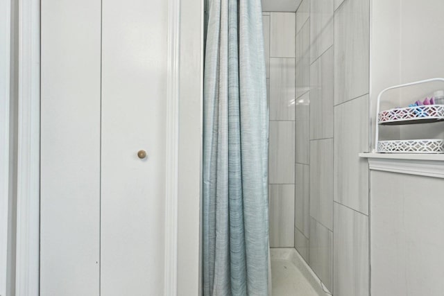 full bathroom with tiled shower