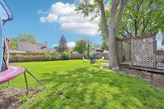 view of yard with a trampoline