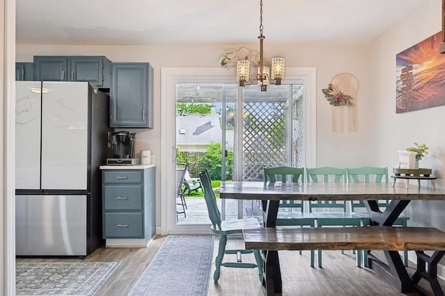 dining room featuring a chandelier and light wood-style floors