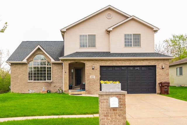695 Cassandra Ln, University Park, IL 60466 - traditional home with a garage, a front lawn, and brick siding