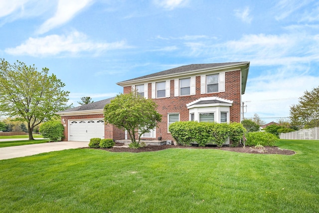 colonial-style house with driveway, a garage, brick siding, fence, and a front lawn
