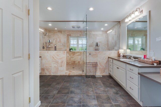 full bathroom featuring walk in shower, vanity, and recessed lighting