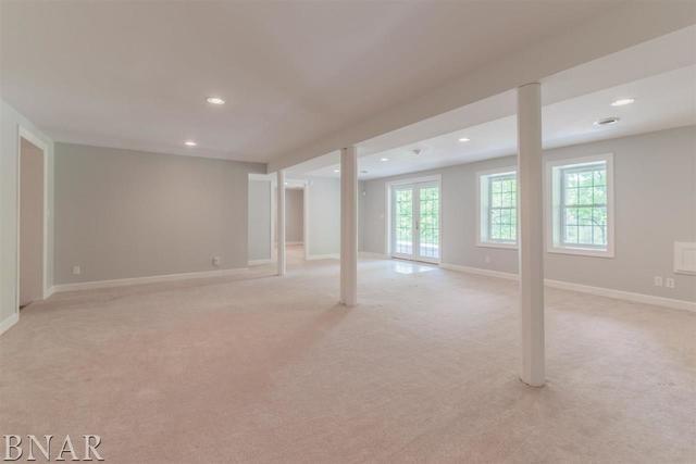 basement featuring light colored carpet, recessed lighting, and baseboards