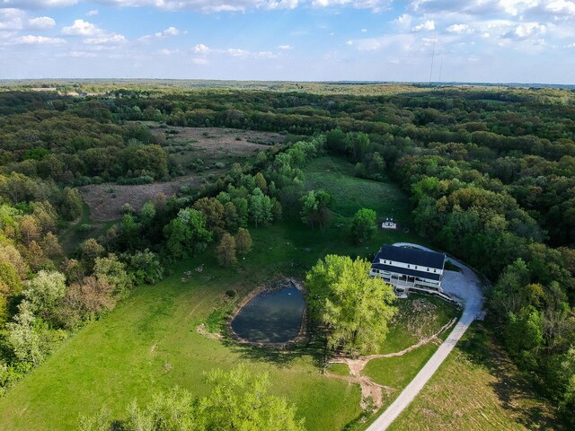 view from above of property featuring a forest