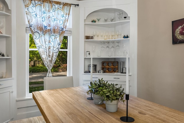 dining room featuring built in shelves