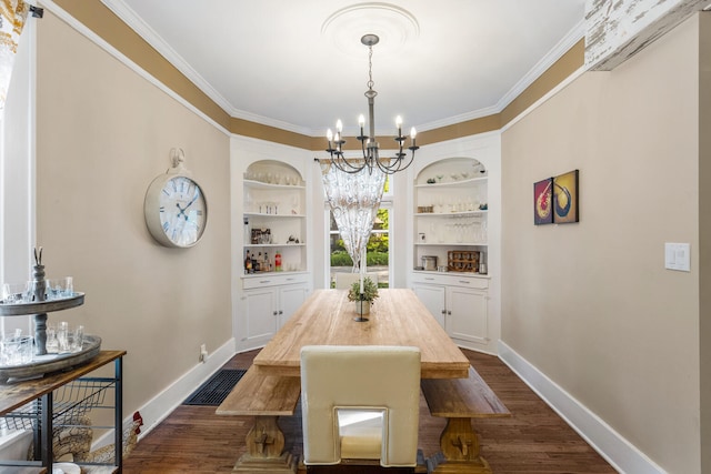 dining space featuring a chandelier, baseboards, dark wood-style flooring, crown molding, and built in features