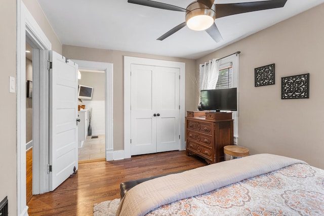 bedroom with wood finished floors, a closet, and a ceiling fan