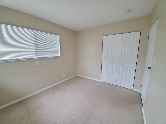 120 Grow Ln, Streamwood, IL 60107 - unfurnished bedroom featuring carpet floors, baseboards, and a closet