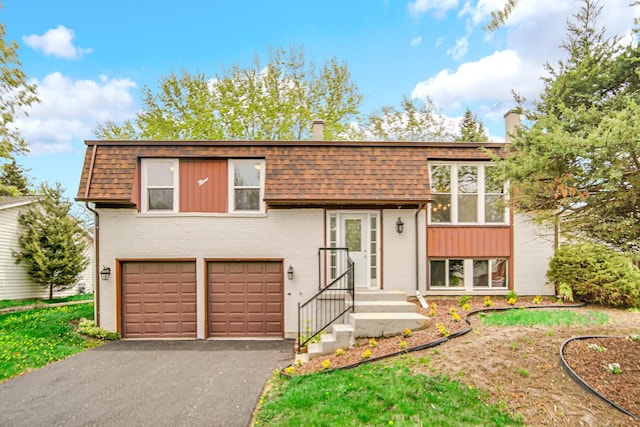 9 Shilling Ct, Bolingbrook, IL 60440 - raised ranch with brick siding, a garage, a chimney, and aphalt driveway