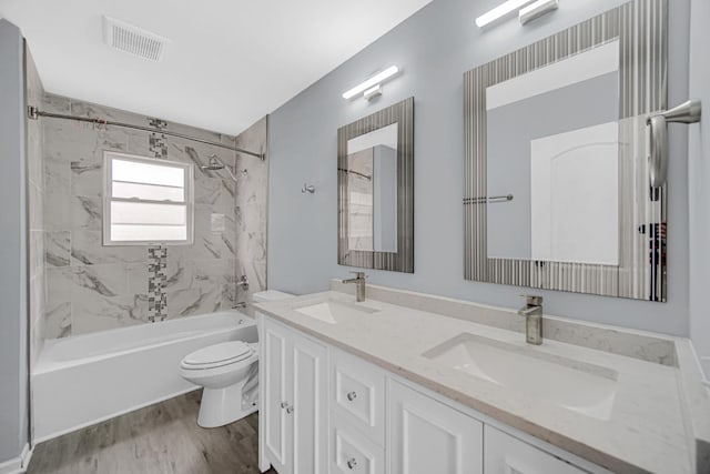 9 Shilling Ct, Bolingbrook, IL 60440 - full bath with toilet, visible vents, a sink, and wood finished floors