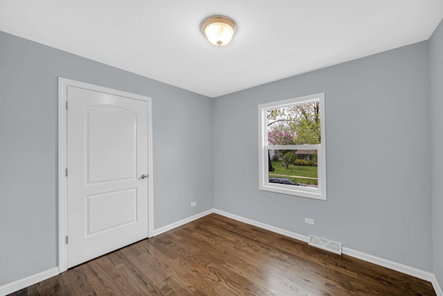 9 Shilling Ct, Bolingbrook, IL 60440 - unfurnished bedroom with baseboards, visible vents, and wood finished floors