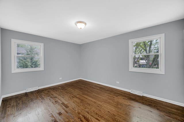 9 Shilling Ct, Bolingbrook, IL 60440 - empty room with visible vents, baseboards, and a healthy amount of sunlight