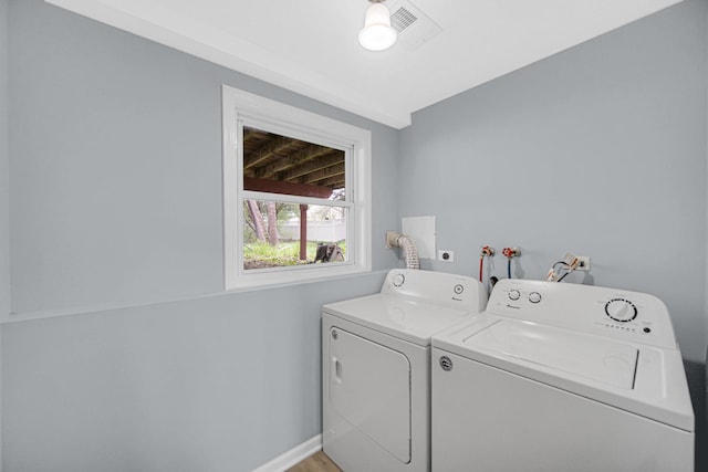 9 Shilling Ct, Bolingbrook, IL 60440 - clothes washing area with laundry area, visible vents, baseboards, light wood-style flooring, and washer and clothes dryer