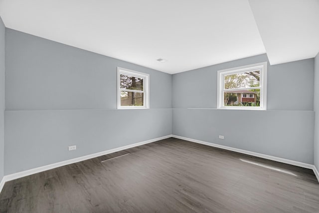 9 Shilling Ct, Bolingbrook, IL 60440 - empty room featuring a healthy amount of sunlight, baseboards, and wood finished floors