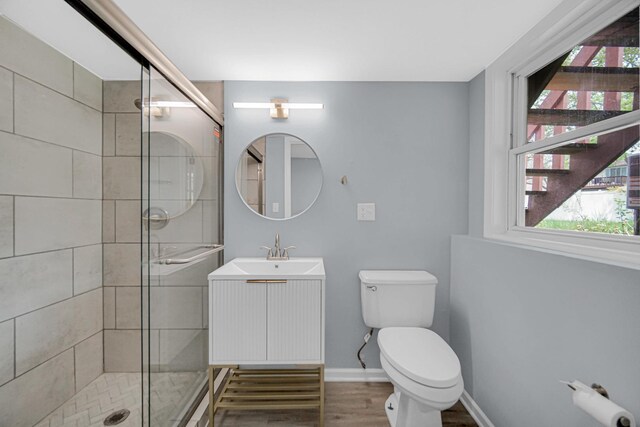 9 Shilling Ct, Bolingbrook, IL 60440 - bathroom with a stall shower, wood finished floors, a healthy amount of sunlight, and toilet