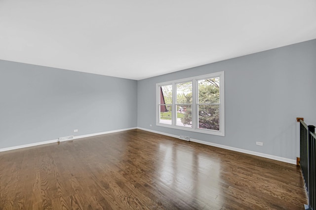 9 Shilling Ct, Bolingbrook, IL 60440 - unfurnished living room with baseboards, visible vents, and dark wood-style floors