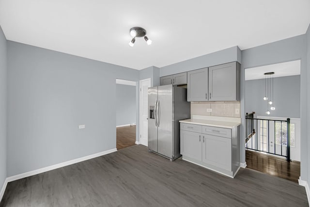 9 Shilling Ct, Bolingbrook, IL 60440 - kitchen featuring gray cabinets, stainless steel refrigerator with ice dispenser, dark wood finished floors, light countertops, and baseboards