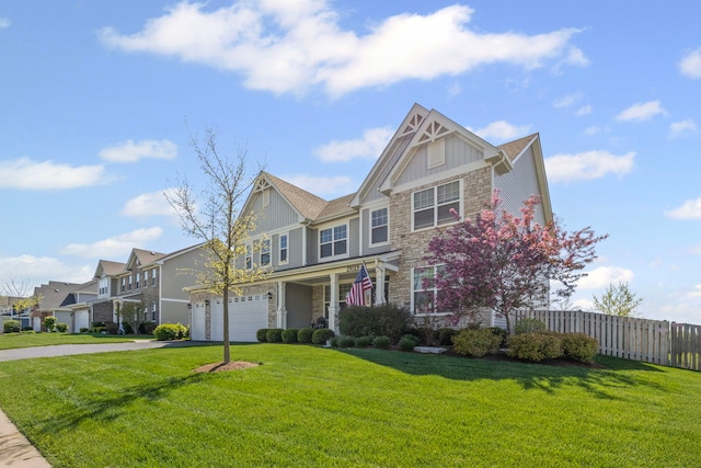 27025 Ashgate Xing, Plainfield, IL 60585 - view of front of property with stone siding, a garage, board and batten siding, driveway, and a porch
