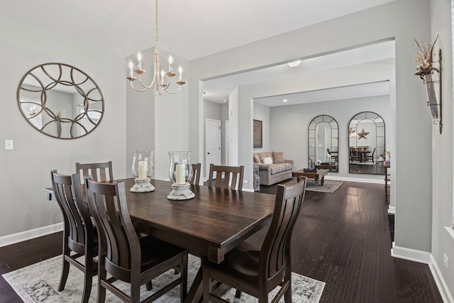 27025 Ashgate Xing, Plainfield, IL 60585 - dining area featuring baseboards, a chandelier, and dark wood-type flooring