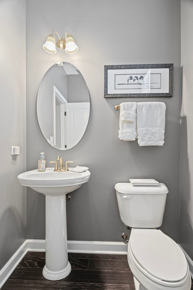 27025 Ashgate Xing, Plainfield, IL 60585 - half bathroom featuring baseboards, toilet, and wood finished floors