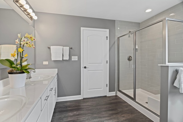 27025 Ashgate Xing, Plainfield, IL 60585 - full bath featuring a shower stall, wood finished floors, recessed lighting, baseboards, and double vanity