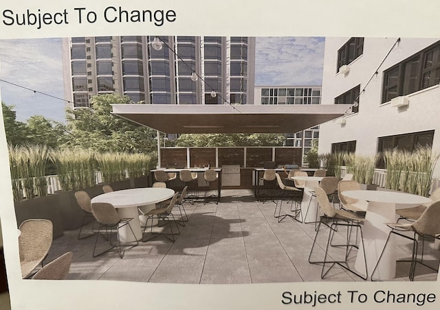 view of patio featuring outdoor dining space and outdoor dry bar