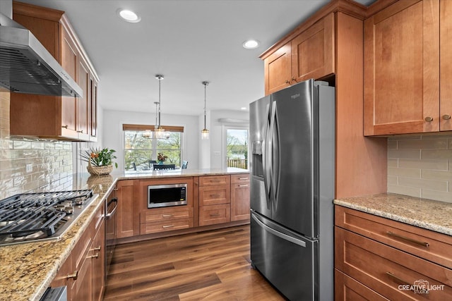 4520 W Shore Dr, Wonder Lake, IL 60097 - kitchen with appliances with stainless steel finishes, wall chimney range hood, dark wood-style floors, recessed lighting, and brown cabinetry