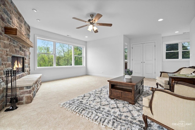 4520 W Shore Dr, Wonder Lake, IL 60097 - carpeted living area featuring a ceiling fan, a fireplace, recessed lighting, and baseboards