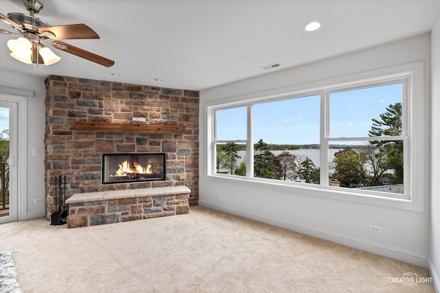 4520 W Shore Dr, Wonder Lake, IL 60097 - unfurnished living room featuring a fireplace, carpet flooring, baseboards, ceiling fan, and recessed lighting
