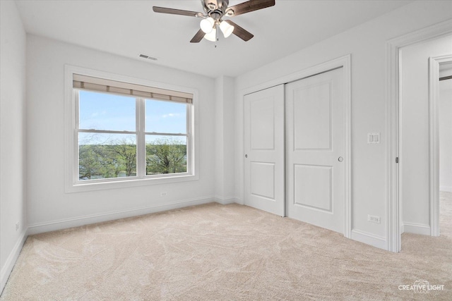 4520 W Shore Dr, Wonder Lake, IL 60097 - unfurnished bedroom featuring carpet flooring, baseboards, a closet, and ceiling fan