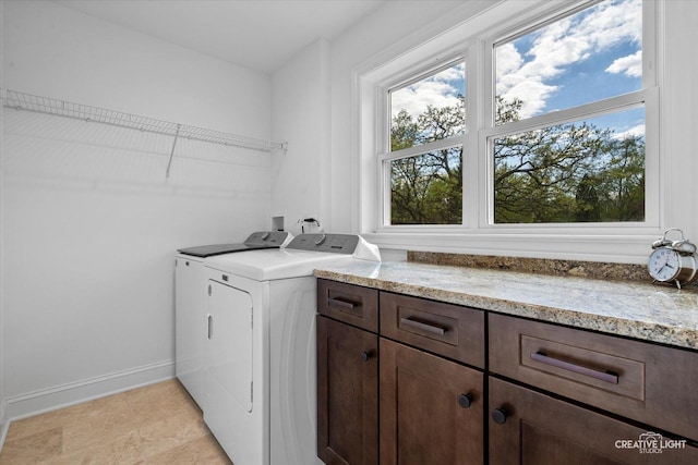4520 W Shore Dr, Wonder Lake, IL 60097 - laundry room with washer and clothes dryer, baseboards, and cabinet space