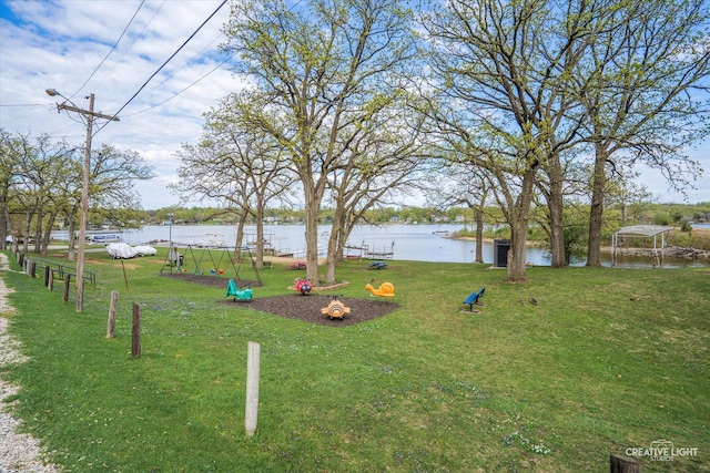 4520 W Shore Dr, Wonder Lake, IL 60097 - surrounding community with a lawn and a water view