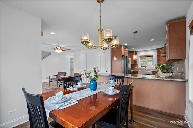 4520 W Shore Dr, Wonder Lake, IL 60097 - dining room with recessed lighting, dark wood-style flooring, a ceiling fan, a chandelier, and baseboards