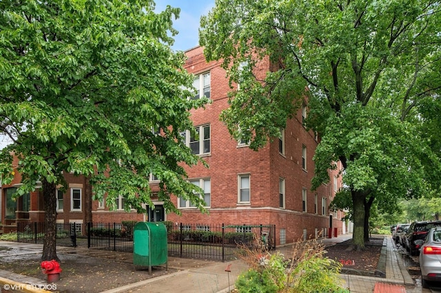3903 N Claremont Ave Unit 1, Chicago, IL 60618 - view of property featuring fence