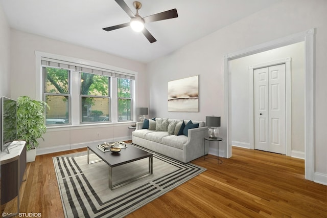 3903 N Claremont Ave Unit 1, Chicago, IL 60618 - living room featuring wood finished floors, ceiling fan, and baseboards