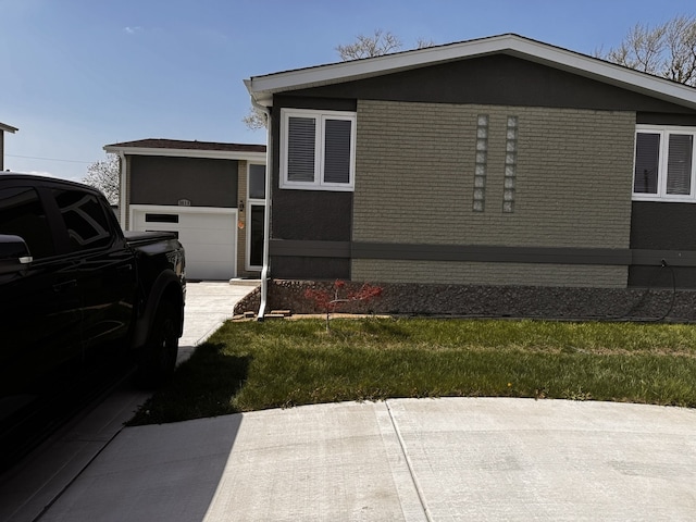 view of side of home with driveway and a garage