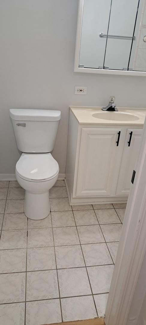 7234 W N Ave Unit 514, Elmwood Park, IL 60707 - bathroom with toilet, baseboards, tile patterned floors, and vanity