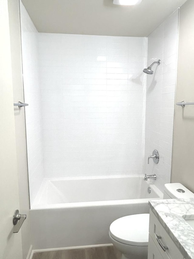 full bath with vanity, bathtub / shower combination, toilet, and wood finished floors