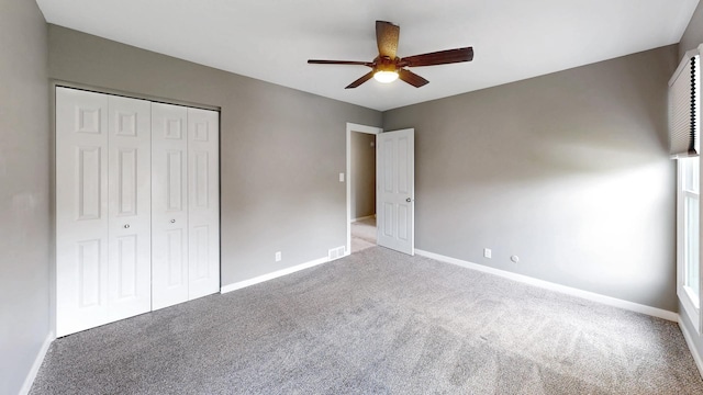 353 Marian Ct, Bolingbrook, IL 60440 - unfurnished bedroom featuring carpet, a closet, baseboards, and a ceiling fan